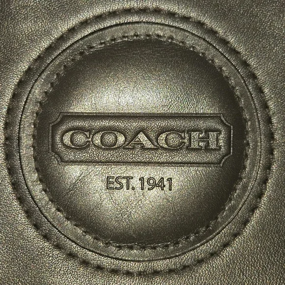 Coach metallic bronze wristlet featuring a detachable strap and a embossed logo - Picture 2 of 7